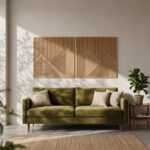 Geometric wood wall art panels above an olive green sofa in a sunlit modern living room