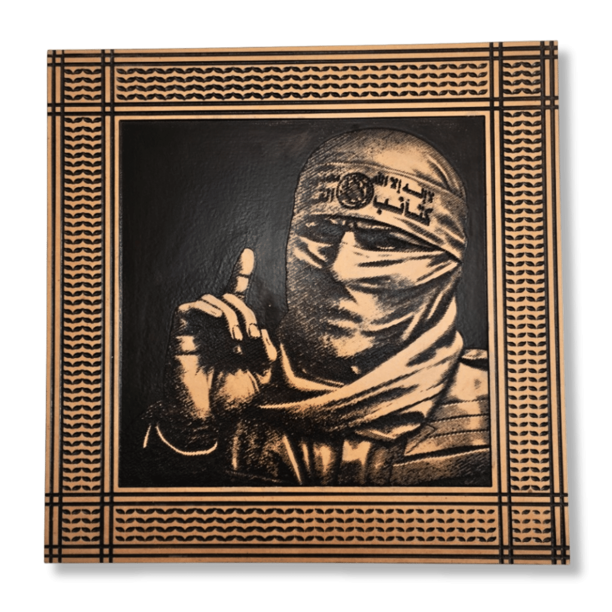 Abu-Obaida-Wall-Art Abu Obaida Wall Art, engraved wood portrait of a masked man with raised finger and patterned border