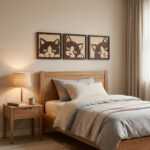 Three handcrafted wood wall art panels featuring cat faces hang above a cozy bed in a softly lit bedroom.
