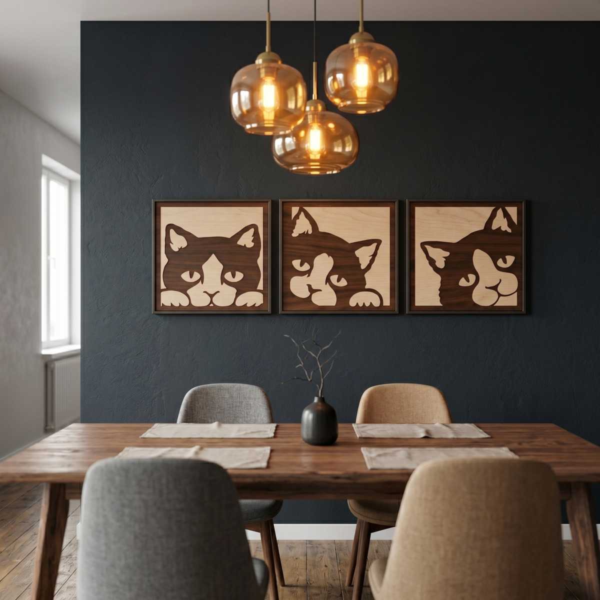 Peeking Cat Animal Wall Art Dining Room Glamorwood Wood wall art featuring three cat faces hangs above a wooden dining table in a modern kitchen with pendant lights.