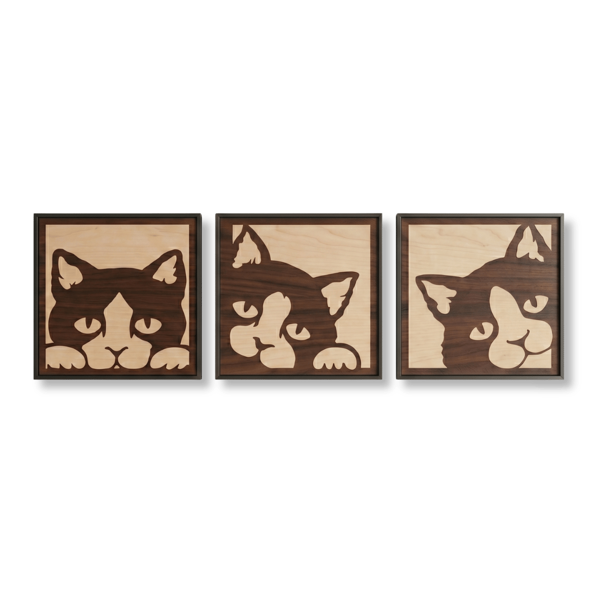 peeking-cat-triptych-wood-wall-art-glamorwood Three framed wooden wall art pieces depicting stylized cat faces in contrasting wood tones.