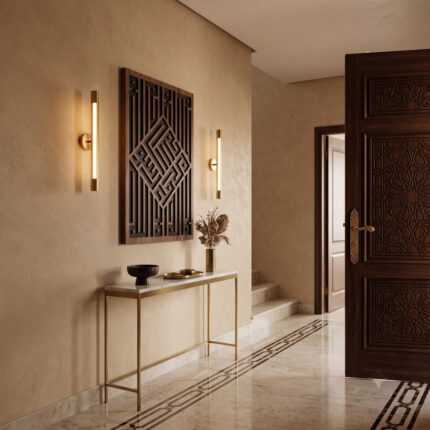 Islamic wall art with geometric Arabic calligraphy above a console table in an elegant entryway