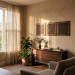 Islamic wall art with geometric Arabic calligraphy above a wooden sideboard in a sunlit living room